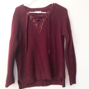 wine colored wool sweater with lace up detail